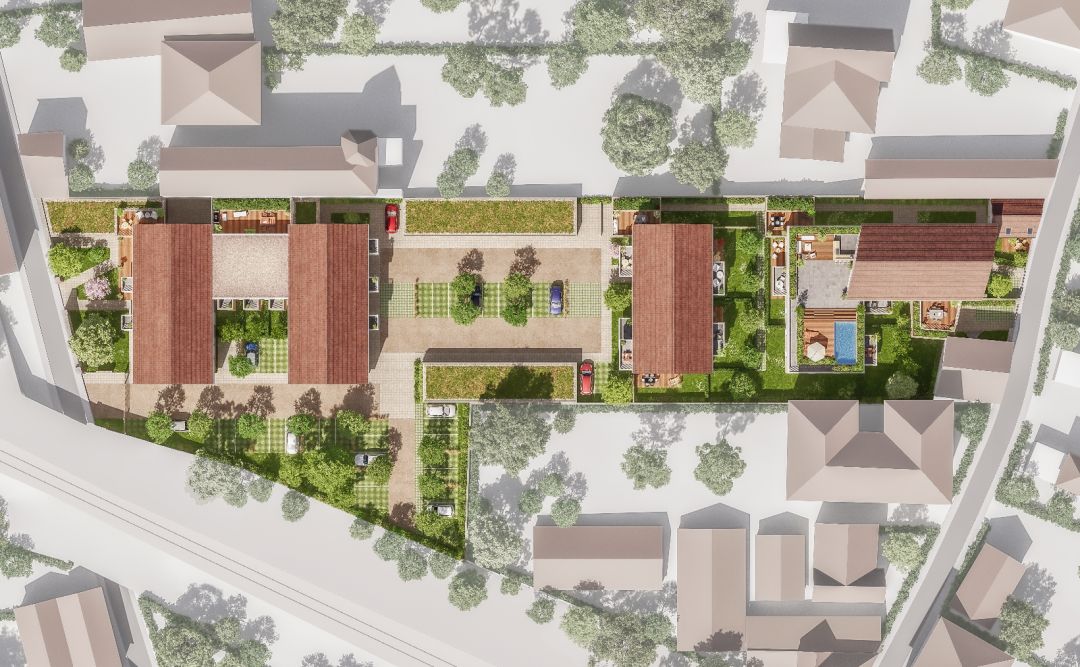 Vue aérienne en 3D du futur programme immobilier Stradim à Troyes, trois immeubles à toits rouges entourés d'espaces verts et de parkings